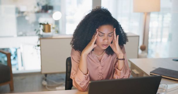 Laptop, business and black woman stress, tired or headache in office fatigue, anxiety or depression. Sad, depressed and mental health risk of digital, online worker or employee burnout and crisis. - Foto, Bild