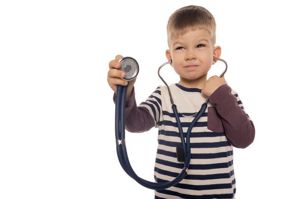 little boy with a stethoscope in hand  - Foto, Bild