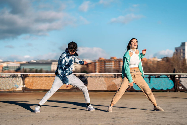 Stock photo of cool girl and her friend practicing their dance moves and having fun. - Foto, Imagem