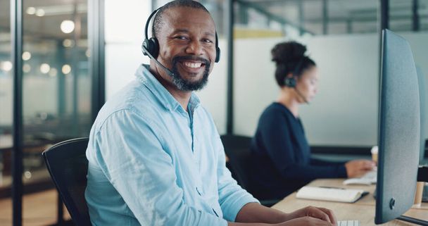 Call center, customer support and face of black man at desk working on computer, online and telemarketing. Crm, contact us and portrait of consultant for friendly service, help and customer service. - Foto, imagen