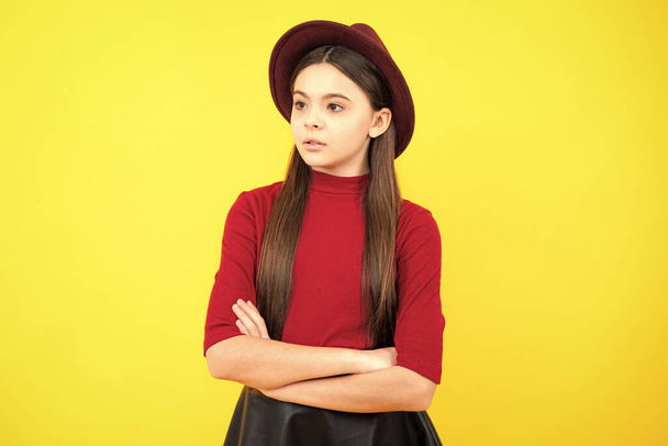 Teenager kid crossed arms with confidence isolated on yellow. Confident teen child girl crossed hands - Fotoğraf, Görsel