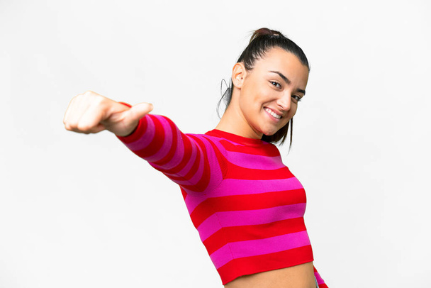 Young beauty woman  over isolated white background giving a thumbs up gesture - Fotó, kép