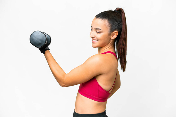 Young sport woman making weightlifting with happy expression - Photo, Image