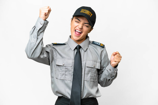 Young safeguard woman over isolated white background celebrating a victory - 写真・画像