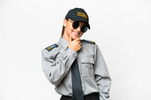 Young safeguard woman over isolated white background with glasses and smiling - Fotografie, Obrázek