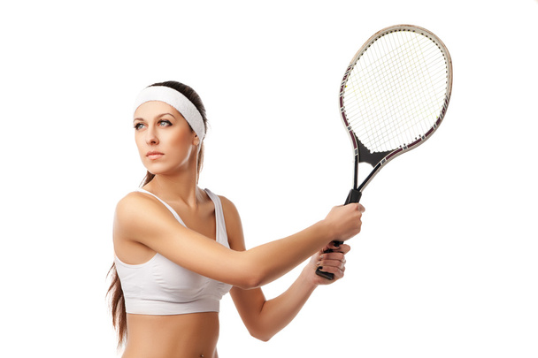 Adult woman playing tennis. - Foto, afbeelding