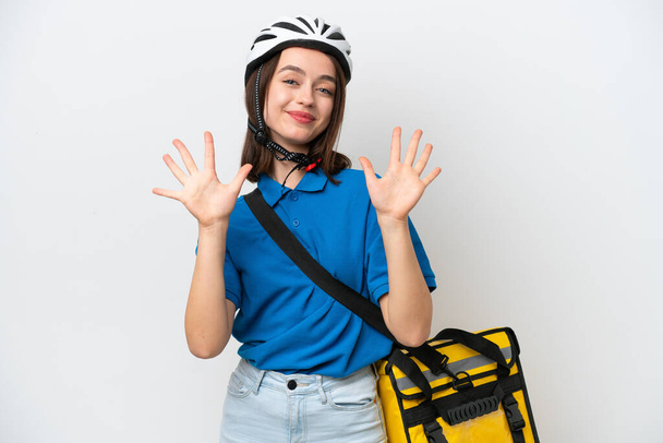 Young Ukrainian woman with thermal backpack isolated on white background counting ten with fingers - Photo, Image