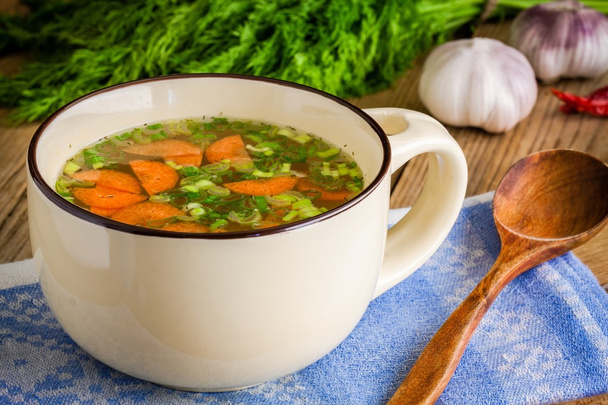 vegetable soup in a cup on a wooden background - Photo, Image