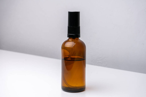 Brown glass cosmetic bottle isolated - Foto, afbeelding