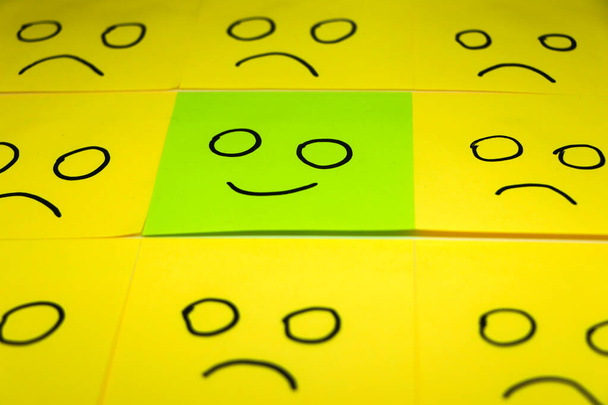 conceptual image for a be different or be happy concept using sticky notes - Photo, Image