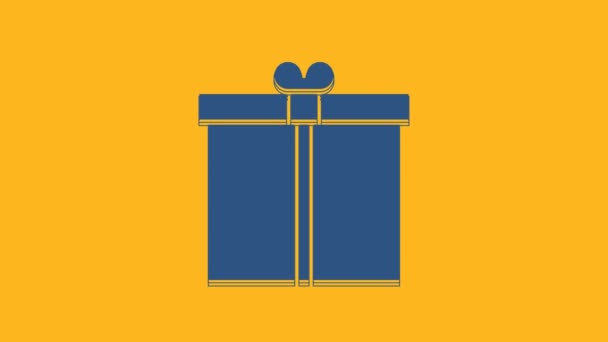 Blue Gift box icon isolated on orange background. 4K Video motion graphic animation. - Felvétel, videó