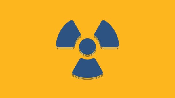 Blue Radioactive icon isolated on orange background. Radioactive toxic symbol. Radiation Hazard sign. 4K Video motion graphic animation. - Video, Çekim