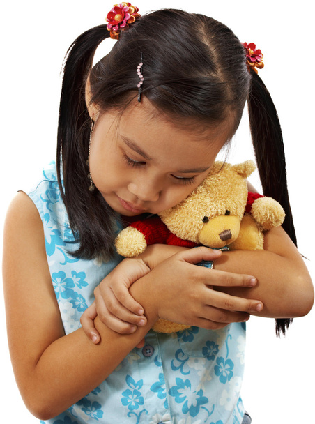 Молодій дівчині люблячої і утримуючи її плюшевий ведмедик - Фото, зображення