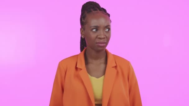 Confused, thinking and a black woman scratching her head in studio on a pink background feeling lost. Question, doubt and idea with an attractive young female looking thoughtful about a memory. - Felvétel, videó