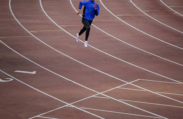 Chelyabinsk, Russia - June 4, 2022: male athlete running training in UFD Athletics Championship - Foto, imagen