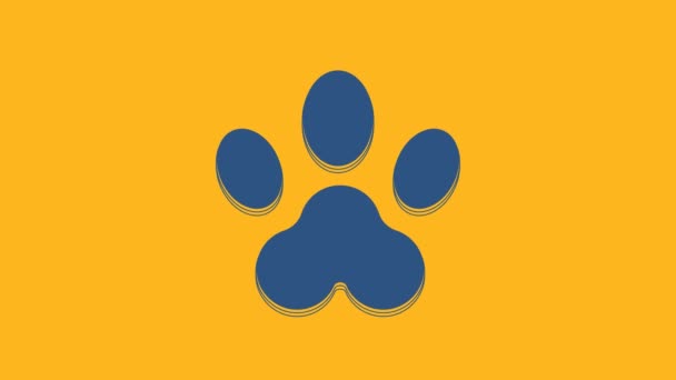 Blaue Pfote Druck Symbol isoliert auf orangefarbenem Hintergrund. Pfotenabdruck für Hund oder Katze. Tierspur. 4K Video Motion Grafik Animation. - Filmmaterial, Video