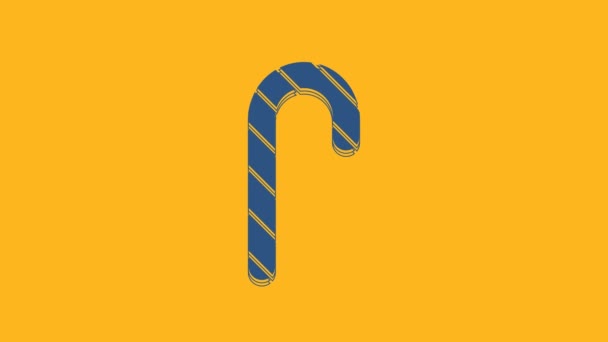 Blue Christmas candy cane with stripes icon isolated on orange background. Merry Christmas and Happy New Year. 4K Video motion graphic animation. - Materiaali, video