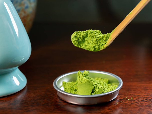 Preparation of green Matcha tea from finely ground powder of specially grown and processed green tea leaves consumed in East Asia and Japan. - Photo, Image