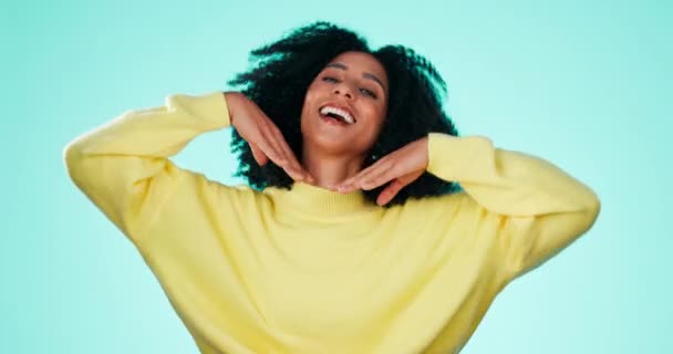Happy black woman, studio and face with smile, pose or beauty with natural afro, edgy fashion or blue background. Gen z model, african and girl with trendy clothes, hair care and cosmetics portrait. - Footage, Video