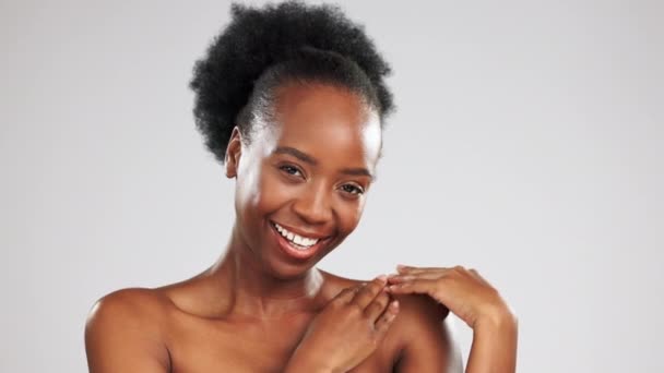 Black woman, face and beauty, skincare and hands, happiness with glow and facial on studio background. Healthy skin, portrait and dermatology with happy female, natural cosmetics and mockup space. - Footage, Video