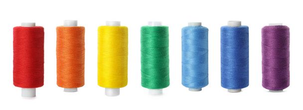 Set of different colorful sewing threads on white background - Фото, изображение