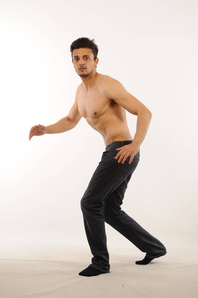 handsome muscular man posing in studio - Fotó, kép