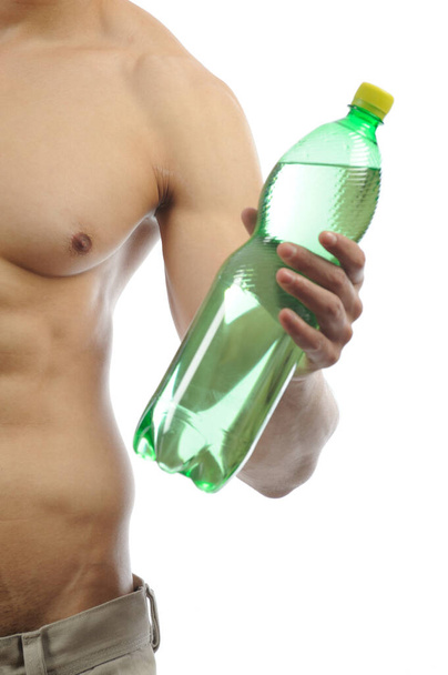 strong man with bottle of water - Foto, Bild