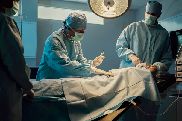 team surgeons operating in hospital - Foto, Imagem