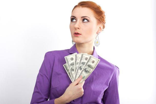 Young girl with bright hundred dollar bills in her  hands. Business woman. bank employee - Photo, Image