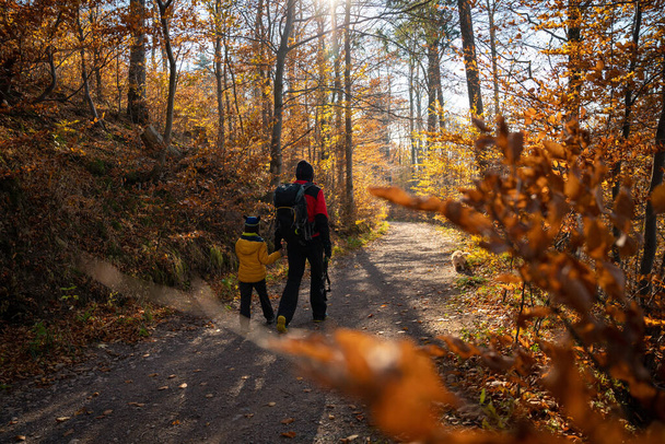 Mum and child are walking along the mountain hiking trail. Family spending time. Polish mountains - Photo, Image