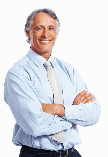 Business man smiling with hands folded. Portrait of mature business man smiling with hands folded over white background - Valokuva, kuva