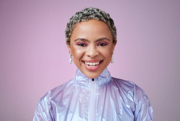 Black woman, fashion and smile with holographic purple studio background with a happy, cosmetics and makeup for retro style. Face beauty portrait of an African female looking trendy with vaporwave. - Photo, image