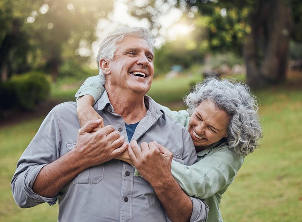 Senior couple hugging in park, garden and retirement to relax, wellness and fresh air in nature in Australia together. Happy man, funny woman and playful elderly people laughing, enjoy joke and love. - Valokuva, kuva