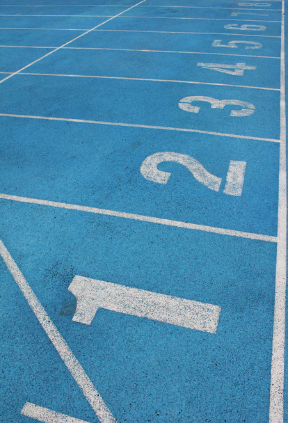 Lanes of a blue race track of numbers - Foto, imagen