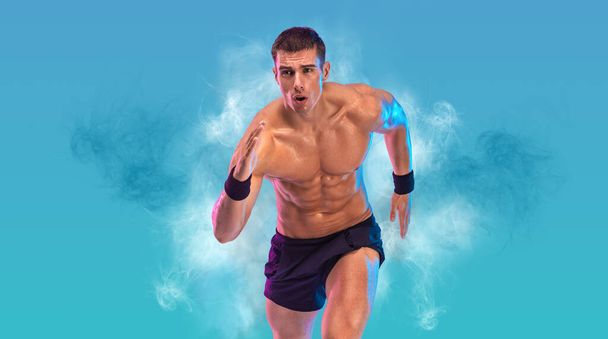 Runner concept. Athlete sprinter running on blue background. Fitness and sport motivation. Trail run - Φωτογραφία, εικόνα