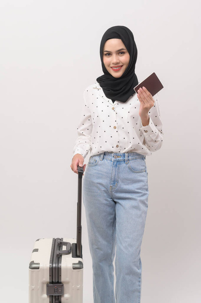 A young muslim woman tourist with baggage  on white background  - Zdjęcie, obraz