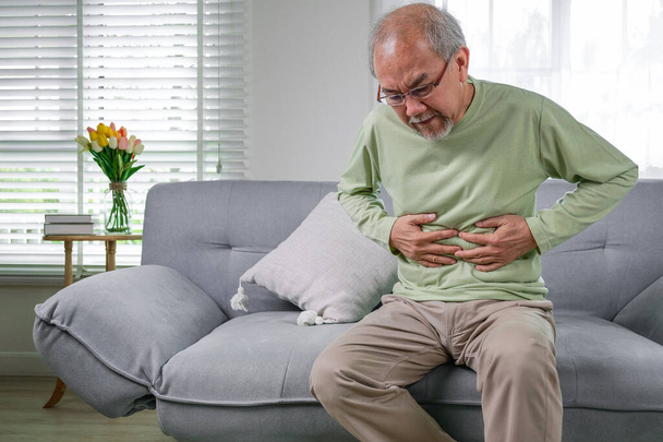Senior stomach pain, Pain in the stomach, Elderly with stomach ache, Elderly upset stomach, Senior constipation hand touch abdomen, Senior man feeling suffer from terrible stomachache - Фото, зображення