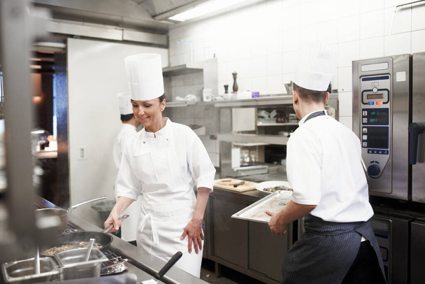Dinner service is in full swing. the inner working of a professional kitchen - Valokuva, kuva