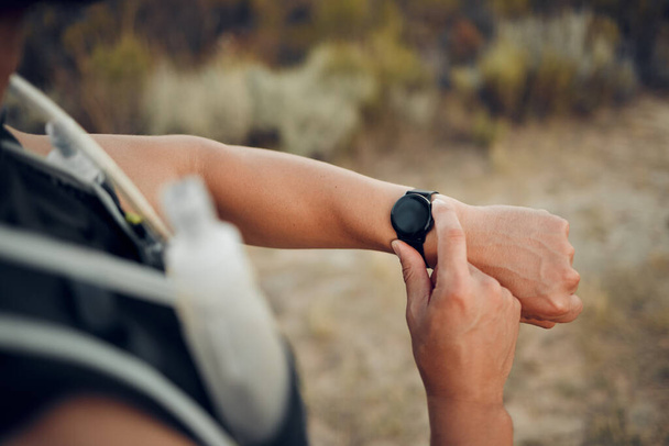 Man, hiking and nature with smartwatch for time on run, workout or race for sport. Technology, fitness and exercise for training, wellness and health on adventure with tech, gps or clock in Bogota. - Photo, Image