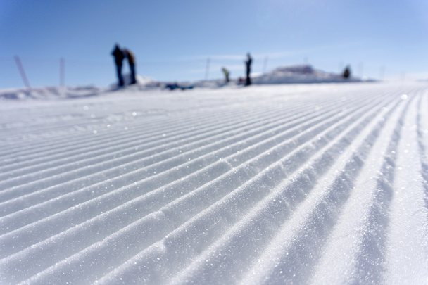 Fresh snow groomer tracks on a ski piste - Fotoğraf, Görsel
