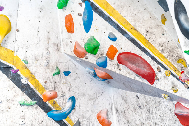 bouldering on an artificial climbing wall. High quality photo - 写真・画像