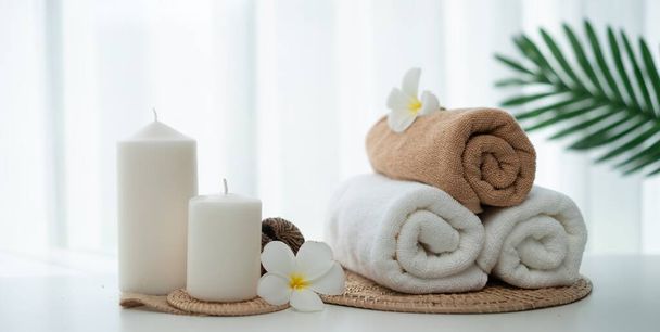 Spa accessory composition set in day spa hotel , beauty wellness center . Spa product are placed in luxury spa resort room , ready for massage therapy from professional service . - Photo, image