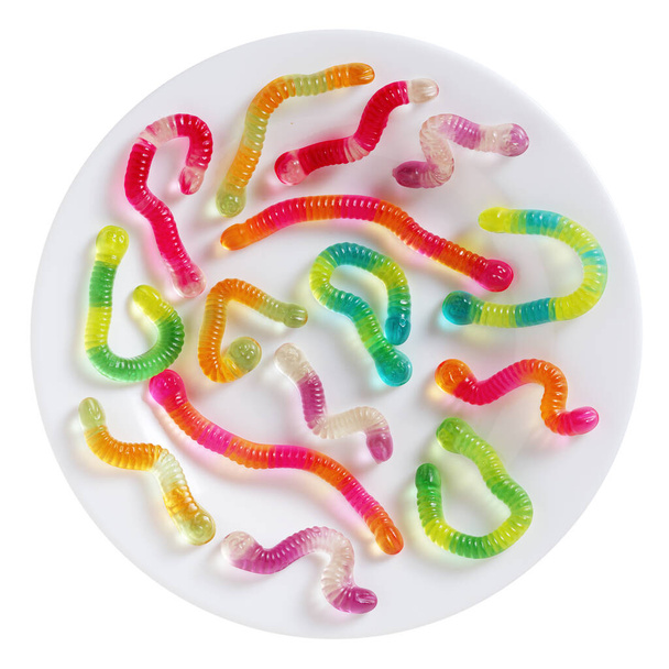Top view of colorful gummy worms on a plate isolated on a white background - Foto, Bild