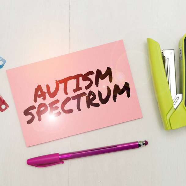 Writing displaying text Autism Spectrum, Business concept impairments in the ability to communicate and socialize - Photo, Image