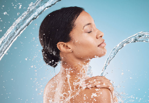 Water, splash and clean beauty with black woman profile and skincare, wellness with hydration and hygiene in blue background mockup. Skin, face and cleaning body with natural cosmetics and self care - Фото, изображение