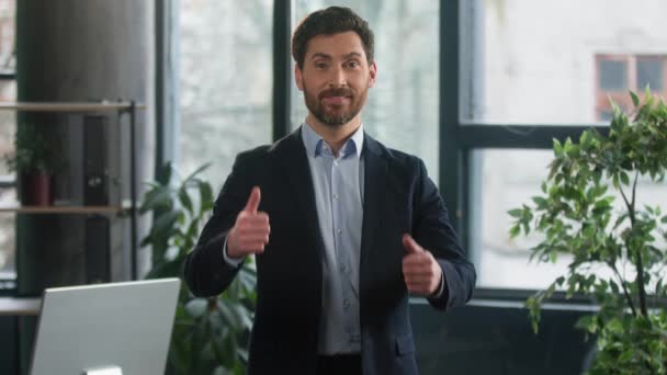 Happy caucasian man businessman entrepreneur standing in office show thumbs up gesture approval satisfied with business progress corporate employee demonstrate sign good result success in work applaud - Metraje, vídeo