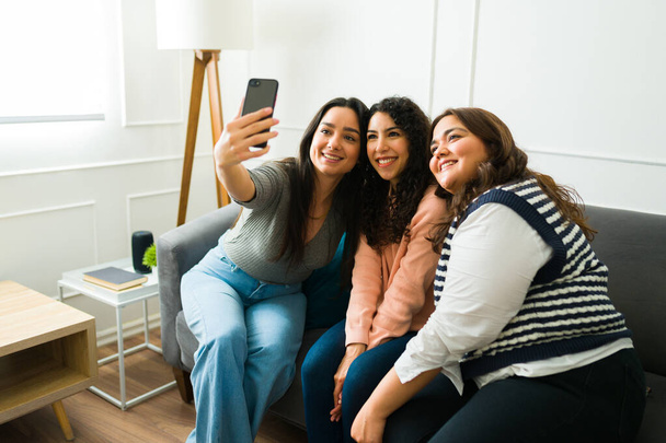 Cheerful young women with a beautiful friendship taking a selfie for social media while hanging out together - Φωτογραφία, εικόνα