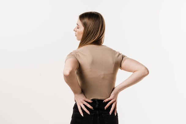 Girl feel backache spine pain because of UTI pyelonephritis disease. Kidney infection pyelonephritis urinary tract infection - Фото, зображення