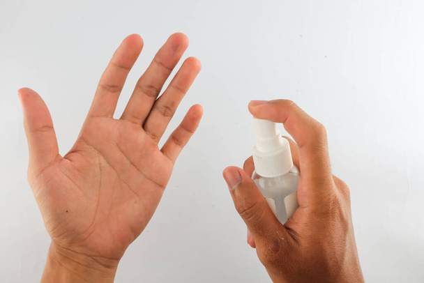 palm spray with hand sanitizer liquid. hands a lot of invisible bacteria. the concept of eradicating and killing germs and bacteria on hands. healthy lifestyle. keep body clean. White Background - Foto, Imagem