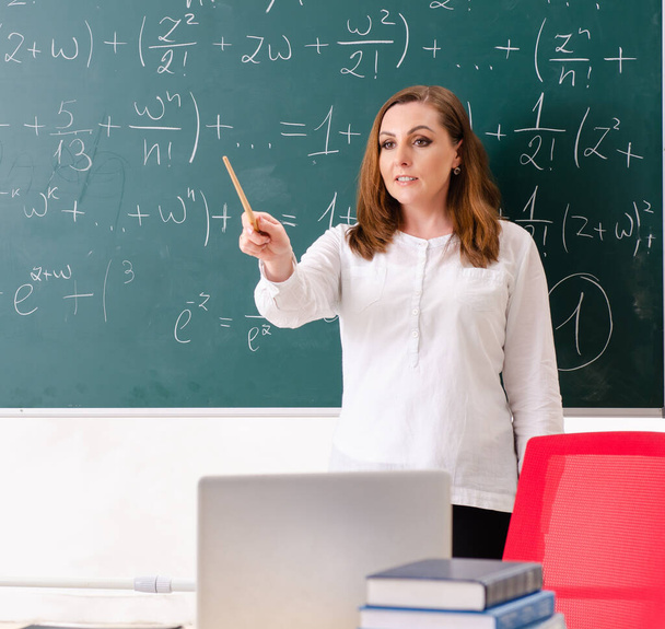 The female math teacher in the classroom - Photo, Image